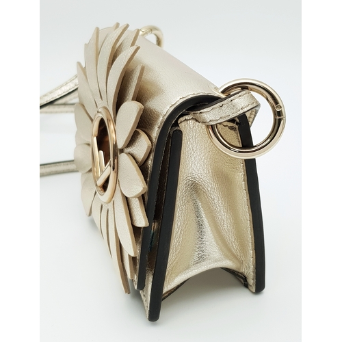 572 - A Fendi Flower Micro Kan I Crossbody Bag. Metallic champagne leather exterior with gold-tone Fendi l... 