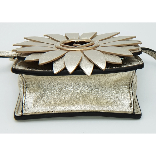 572 - A Fendi Flower Micro Kan I Crossbody Bag. Metallic champagne leather exterior with gold-tone Fendi l... 