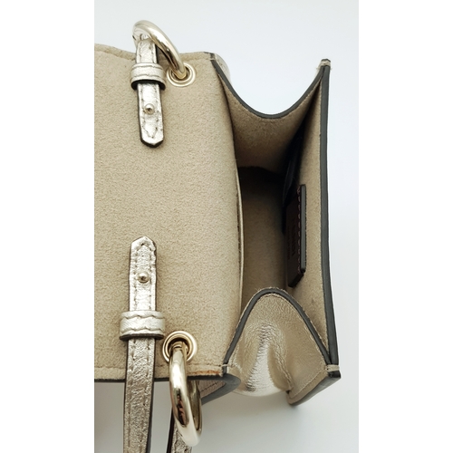 572 - A Fendi Flower Micro Kan I Crossbody Bag. Metallic champagne leather exterior with gold-tone Fendi l... 
