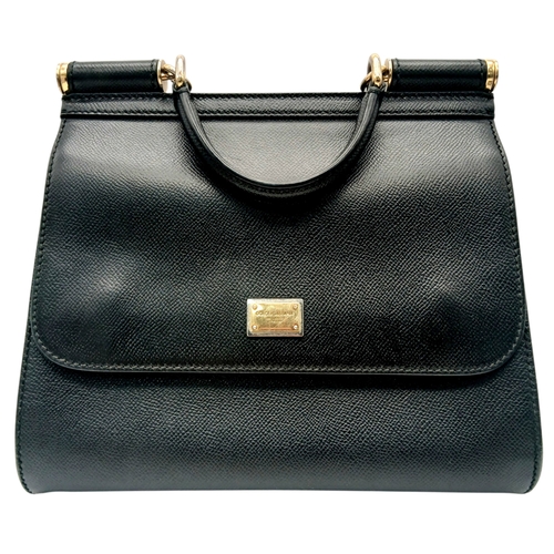 565 - A Dolce & Gabbana Dauphine Small Miss Sicily Satchel Bag. Black grained leather exterior with gold-t... 