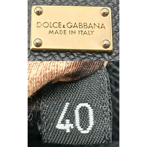 565 - A Dolce & Gabbana Dauphine Small Miss Sicily Satchel Bag. Black grained leather exterior with gold-t... 