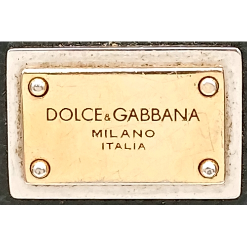 565 - A Dolce & Gabbana Dauphine Small Miss Sicily Satchel Bag. Black grained leather exterior with gold-t... 