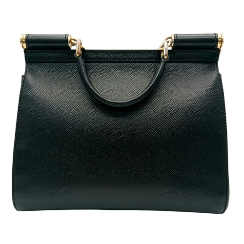 565 - A Dolce & Gabbana Dauphine Small Miss Sicily Satchel Bag. Black grained leather exterior with gold-t... 