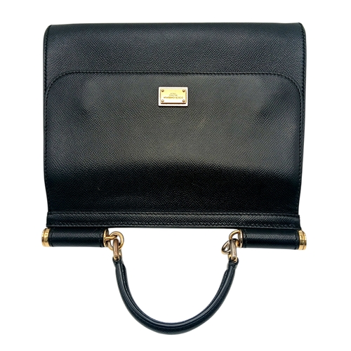 565 - A Dolce & Gabbana Dauphine Small Miss Sicily Satchel Bag. Black grained leather exterior with gold-t... 
