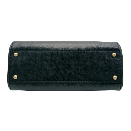 565 - A Dolce & Gabbana Dauphine Small Miss Sicily Satchel Bag. Black grained leather exterior with gold-t... 