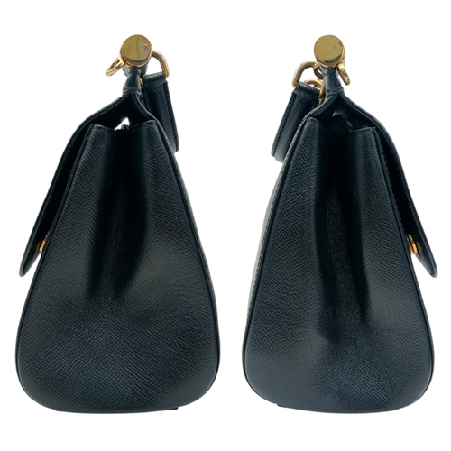 565 - A Dolce & Gabbana Dauphine Small Miss Sicily Satchel Bag. Black grained leather exterior with gold-t... 