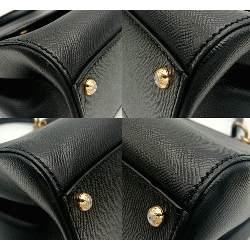 565 - A Dolce & Gabbana Dauphine Small Miss Sicily Satchel Bag. Black grained leather exterior with gold-t... 