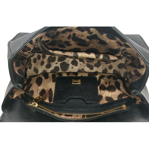 565 - A Dolce & Gabbana Dauphine Small Miss Sicily Satchel Bag. Black grained leather exterior with gold-t... 