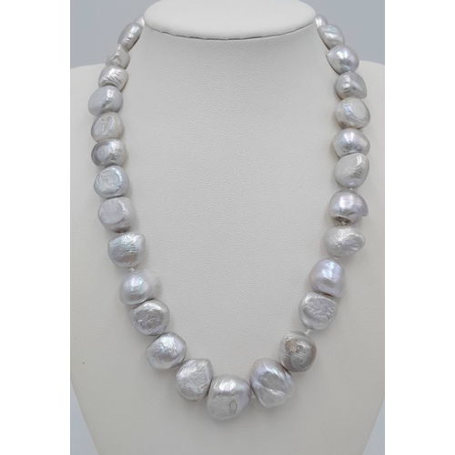 1244 - A Silver Tone Freshwater Irregular Shaped Pearl Necklace with 925 Silver Clasp. Pearls - 10/12mm. 42... 