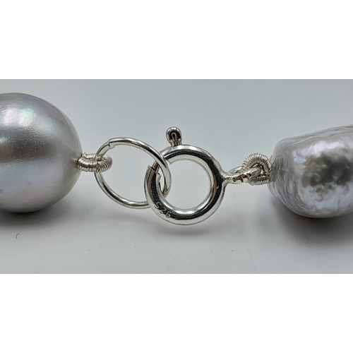 1244 - A Silver Tone Freshwater Irregular Shaped Pearl Necklace with 925 Silver Clasp. Pearls - 10/12mm. 42... 