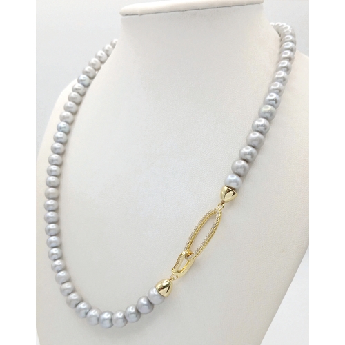 1258 - A Silver-Tone Freshwater Pearl Necklace with Gilded Clasp. 6/7mm pearls. 44cm length. MK23