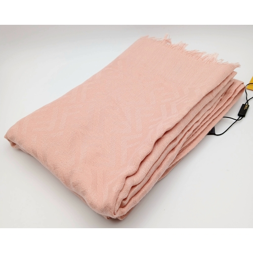 558 - A Fendi Pink FF Monogram Scarf. Soft pink fabric with tonal FF monogram throughout and fringed edges... 