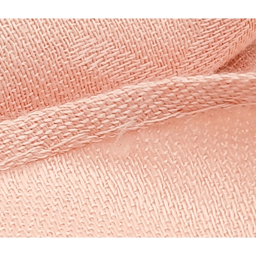 558 - A Fendi Pink FF Monogram Scarf. Soft pink fabric with tonal FF monogram throughout and fringed edges... 