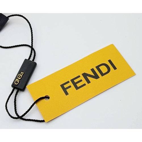 558 - A Fendi Pink FF Monogram Scarf. Soft pink fabric with tonal FF monogram throughout and fringed edges... 