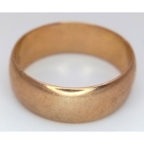 17 - A Vintage 9K Yellow Gold Band Ring. UK hallmarks. 7mm width. Size T 1/2. 5.6g.
