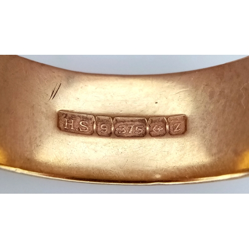 17 - A Vintage 9K Yellow Gold Band Ring. UK hallmarks. 7mm width. Size T 1/2. 5.6g.