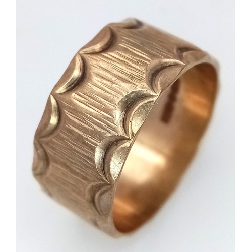 3 - A Vintage Hallmarked 9K Gold Band Ring. Decorative geometric pattern exterior. 9mm width. Size O. 4.... 