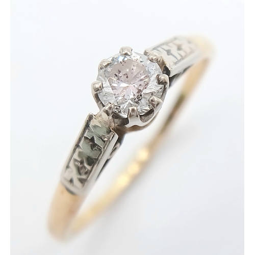 44 - An 18K Gold and Platinum Diamond Solitaire Ring. 0.25ct round brilliant cut diamond. Size L 1/2. 2g ... 