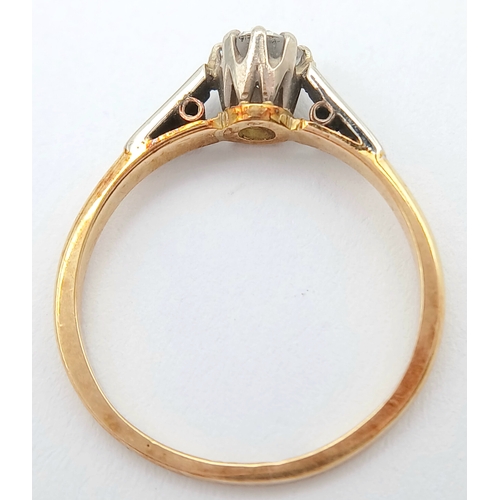 44 - An 18K Gold and Platinum Diamond Solitaire Ring. 0.25ct round brilliant cut diamond. Size L 1/2. 2g ... 
