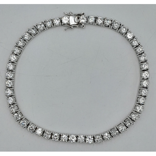 564 - A Sterling Silver Diamonique Cubic Zirconia Set Tennis Bracelet-19cm Length. Set with Forty-Six 3mm ... 
