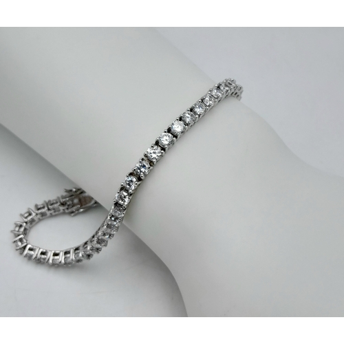 564 - A Sterling Silver Diamonique Cubic Zirconia Set Tennis Bracelet-19cm Length. Set with Forty-Six 3mm ... 