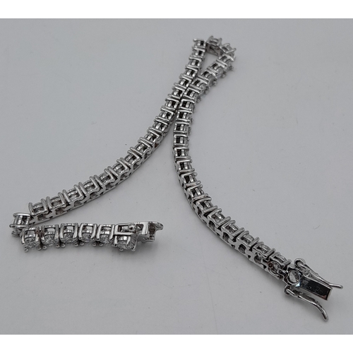 564 - A Sterling Silver Diamonique Cubic Zirconia Set Tennis Bracelet-19cm Length. Set with Forty-Six 3mm ... 