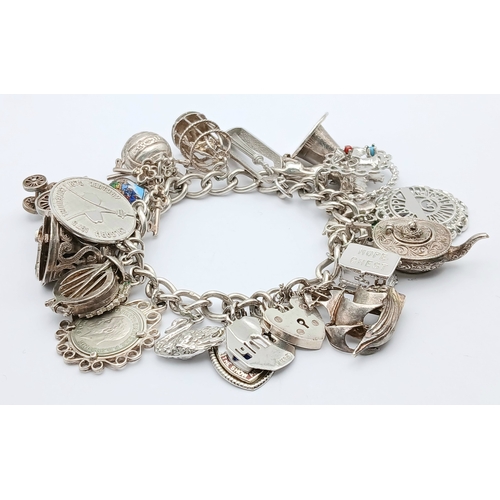 602 - Vintage SILVER CHARM BRACELET absolutely full of interesting and unusual SILVER CHARMS. To include T... 