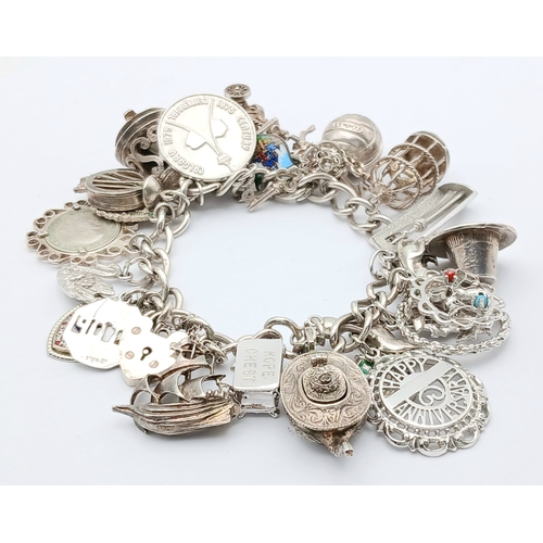 602 - Vintage SILVER CHARM BRACELET absolutely full of interesting and unusual SILVER CHARMS. To include T... 