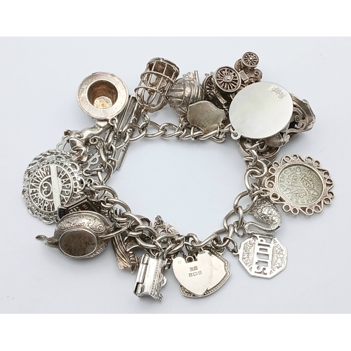 602 - Vintage SILVER CHARM BRACELET absolutely full of interesting and unusual SILVER CHARMS. To include T... 