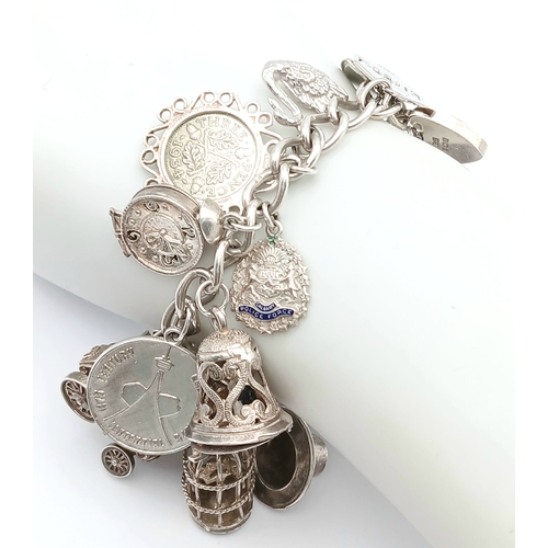 602 - Vintage SILVER CHARM BRACELET absolutely full of interesting and unusual SILVER CHARMS. To include T... 