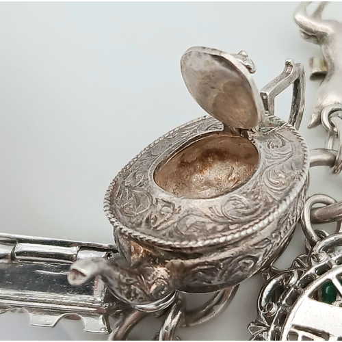 602 - Vintage SILVER CHARM BRACELET absolutely full of interesting and unusual SILVER CHARMS. To include T... 