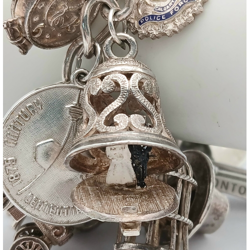 602 - Vintage SILVER CHARM BRACELET absolutely full of interesting and unusual SILVER CHARMS. To include T... 