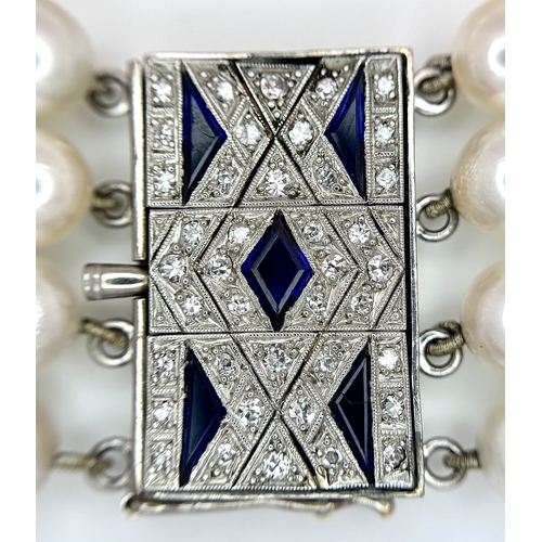 1253 - A FOUR ROW, 8MM AKOYA DESIGNER PEARL BRACELET. WITH A 14K WHITE GOLD, ART DECO DESIGN, DIAMOND AND S... 