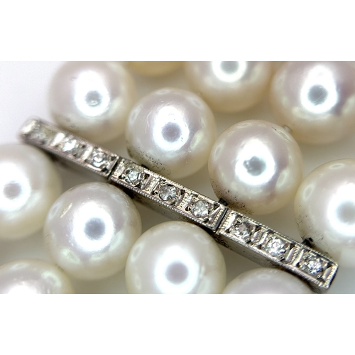 1253 - A FOUR ROW, 8MM AKOYA DESIGNER PEARL BRACELET. WITH A 14K WHITE GOLD, ART DECO DESIGN, DIAMOND AND S... 