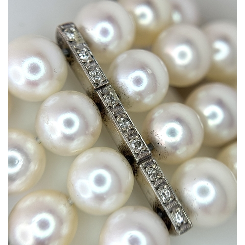 1253 - A FOUR ROW, 8MM AKOYA DESIGNER PEARL BRACELET. WITH A 14K WHITE GOLD, ART DECO DESIGN, DIAMOND AND S... 