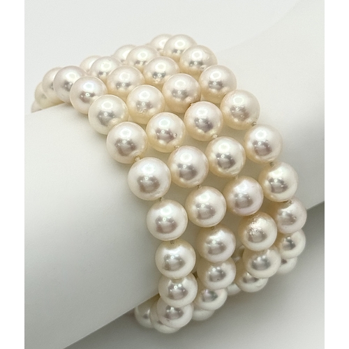 1253 - A FOUR ROW, 8MM AKOYA DESIGNER PEARL BRACELET. WITH A 14K WHITE GOLD, ART DECO DESIGN, DIAMOND AND S... 