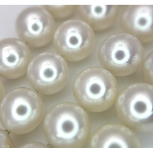 1253 - A FOUR ROW, 8MM AKOYA DESIGNER PEARL BRACELET. WITH A 14K WHITE GOLD, ART DECO DESIGN, DIAMOND AND S... 