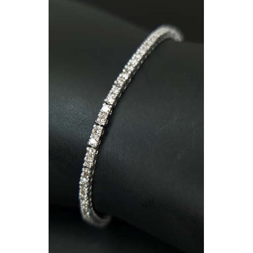 1260 - AN 18K WHITE GOLD, DIAMOND SET, TENNIS LINE BRACELET. 1.75CTW. 7.6G. SC 1068