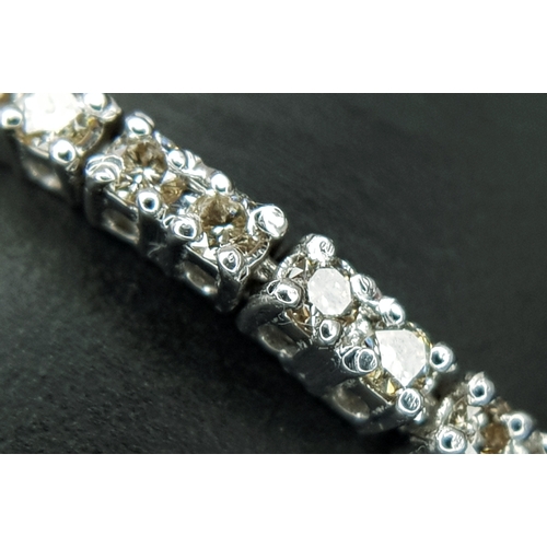 1260 - AN 18K WHITE GOLD, DIAMOND SET, TENNIS LINE BRACELET. 1.75CTW. 7.6G. SC 1068