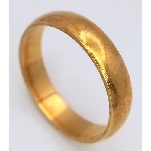 45 - An 18K Yellow Gold Band Ring. UK hallmarks. 4mm width. Size M. 3.25g.