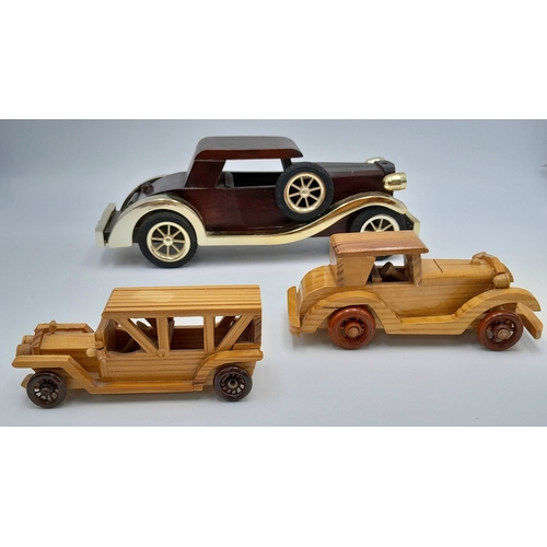 1206 - Six hand made wooden car models. Nice models.