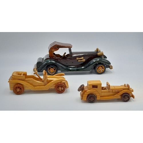 1206 - Six hand made wooden car models. Nice models.