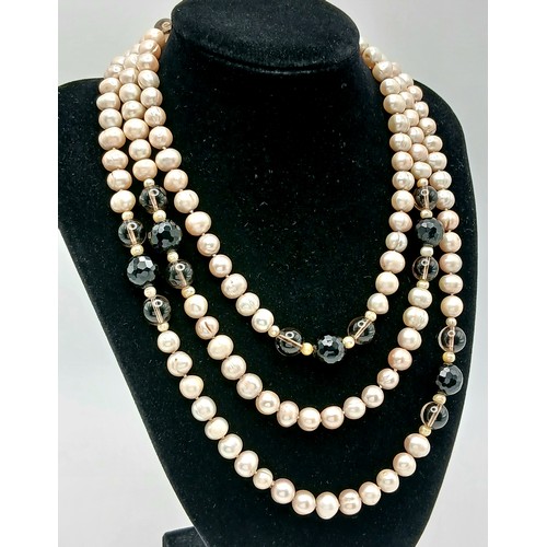 1205 - An attractive rope length Pink Freshwater Pearl Necklace with Black and Brown Bead Spacers. Approx 1... 