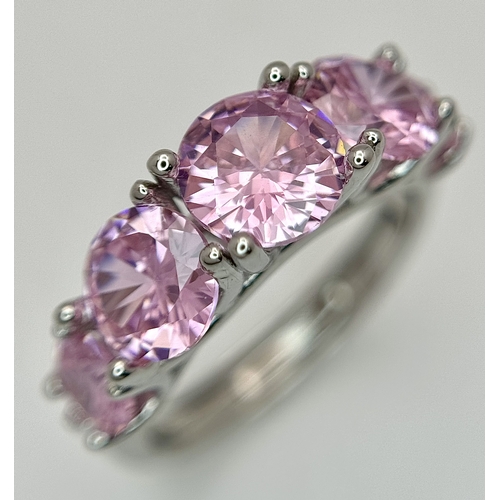 1237 - Four Stone Set Silver Rings (adjustable) and a Pair of Moissanite Silver Stud Earrings with a certif... 