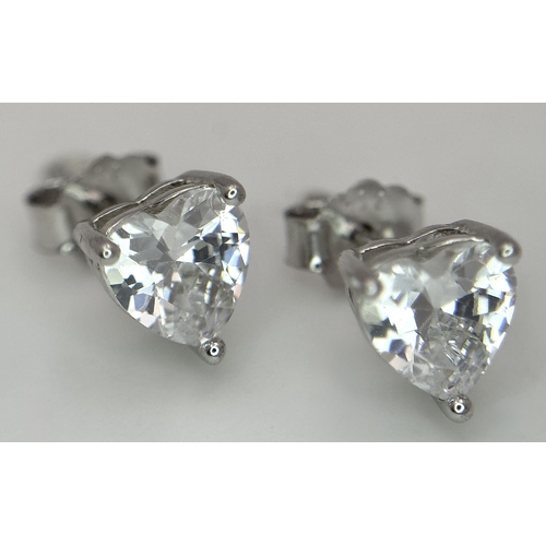 1237 - Four Stone Set Silver Rings (adjustable) and a Pair of Moissanite Silver Stud Earrings with a certif... 