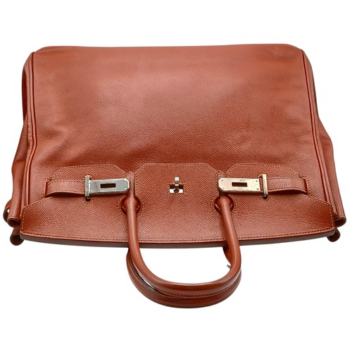 33 - An Hermès Brick Red Courchevel Birkin 35 Handbag. Brick red Courchevel leather exterior with silver-... 