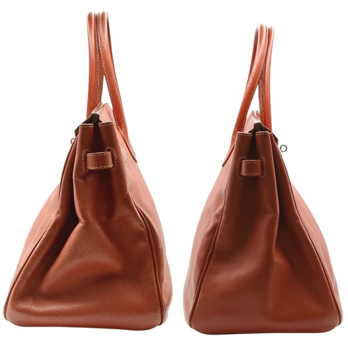 33 - An Hermès Brick Red Courchevel Birkin 35 Handbag. Brick red Courchevel leather exterior with silver-... 