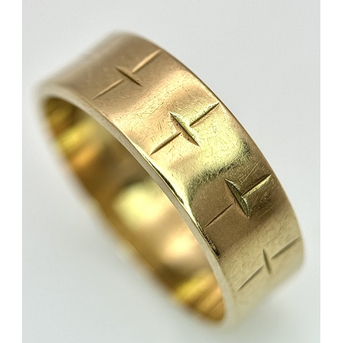 25 - A 9K Yellow Gold Band Ring with Geometric Pattern. 5mm width. Size L 1/2. 2.75g.