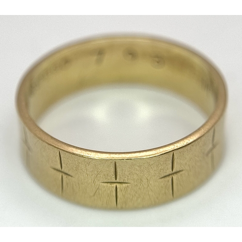 25 - A 9K Yellow Gold Band Ring with Geometric Pattern. 5mm width. Size L 1/2. 2.75g.