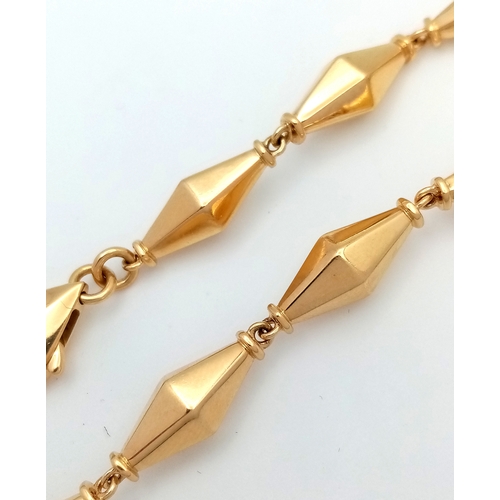 40 - A Cleopatra 18K Yellow Gold Faceted Barrel Link Classic Bracelet. Approx 18.5cm length. Total weight... 